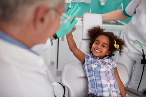 Child sitting in a dentist chair